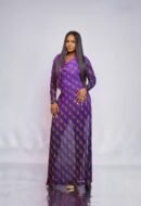 Model in the ARYA floor-length purple cowl neck mesh dress with the Plum & Grey monogram