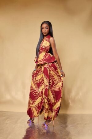 Model in the BOHO adire crepe halter peplum top and wide-leg trousers set
