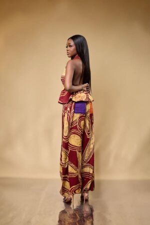 Model in the BOHO adire crepe halter peplum top and wide-leg trousers set
