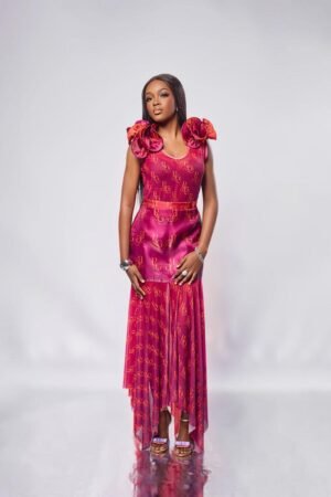 Model in the JIVA fuchsia organza and mesh high-low skirt